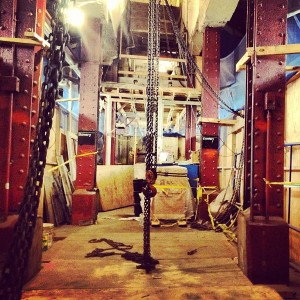 Construction work at Bowery subway station, carefully captured through a hole in the wall. :P