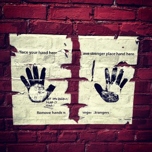 Place your hand here. Have stranger place hand here. Remove hands when no longer strangers.