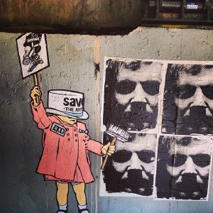 Wheatpaste art under a bridge on the Shoal Creek trail.
